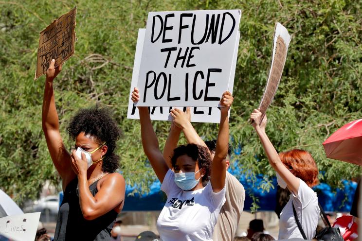 Protesters rally Wednesday, June 3, 2020, in Phoenix, demanding the Phoenix City Council defund the Phoenix Police Department.