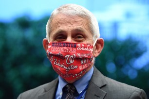 Director of the National Institute for Allergy and Infectious Diseases Dr. Anthony Fauci wears a Washington Nationals face mask when he arrives to testify before the House Committee on Energy and Commerce on the Trump Administration