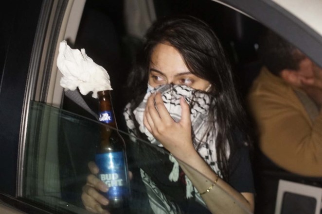 Lawyers Urooj Rahman (left) and Colinford Mattis are seen driving