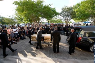 The casket of George Floyd is removed after a public visitation at the Fountain of Praise church