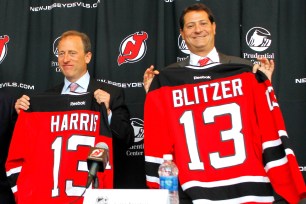 Joshua Harris and David Blitzer pose for a photo after buying the Devils in 2013.