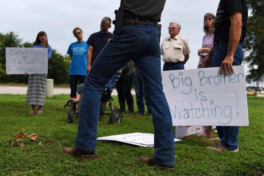 A small group of people gather to protest contact tracing for the coronavirus disease (COVID-19) in Conroe, Texas, U.S. June 1, 2020.