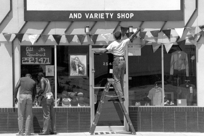 A business owner puts up Juneteenth decorations in 1989