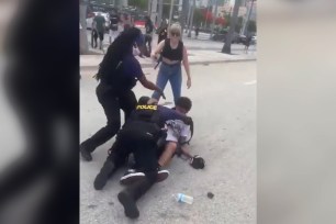 Protestors clash with Miami police.