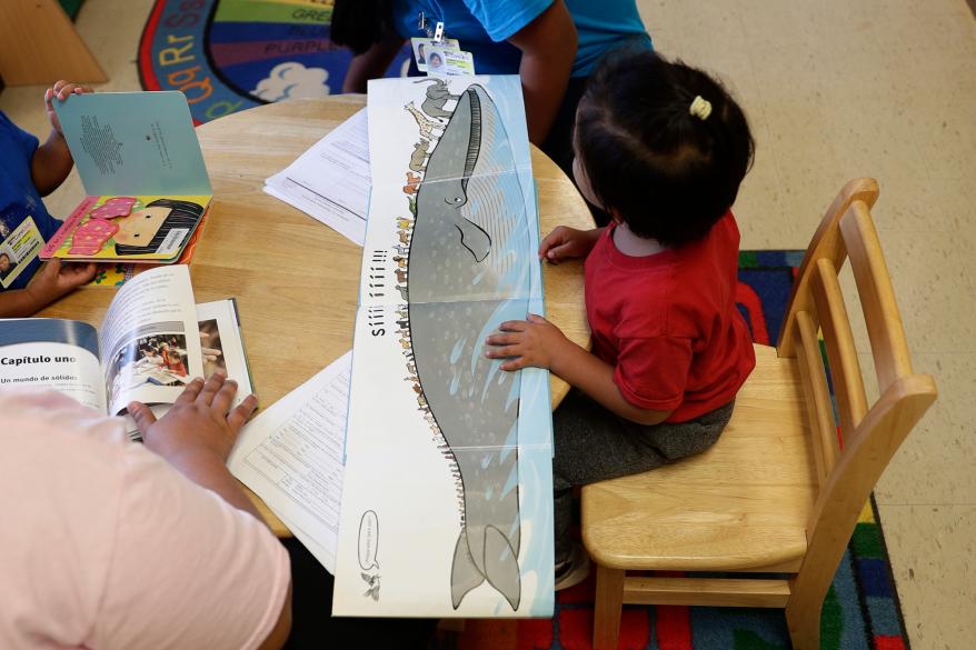 Immigrants seeking asylum use the library at the ICE South Texas Family Residential Center in Dilley, Texas.