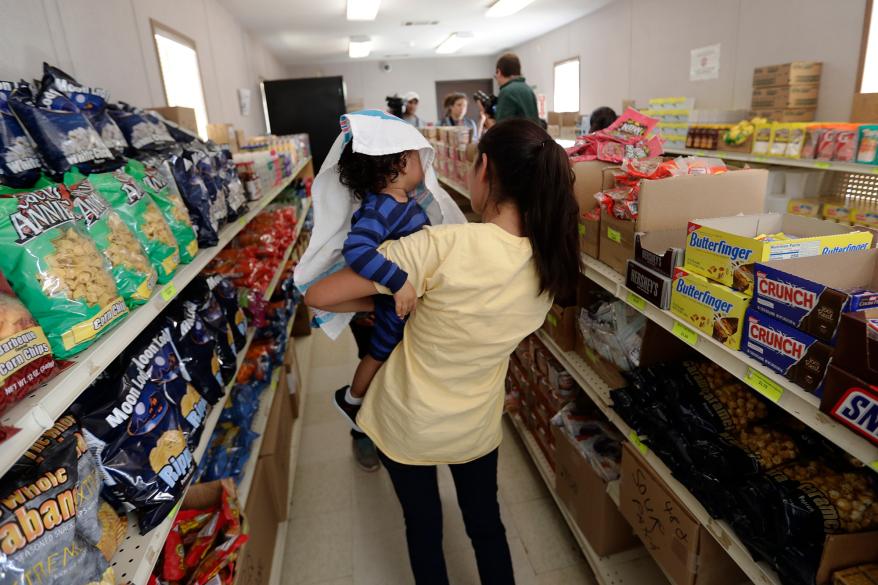 Immigrants seeking asylum shop in a small store at the ICE South Texas Family Residential Center in Dilley, Texas.