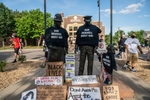 Protesters' signs calling for police union Lt. Bob Kroll to be fired in Minneapolis, Minnesota.