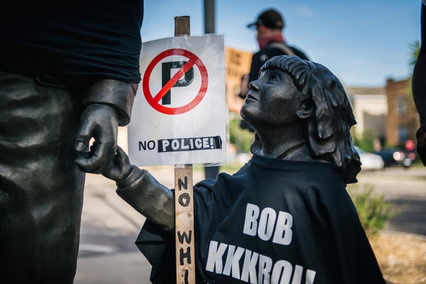 Shirts put on statues in Minneapolis calling for abolishing the police force.