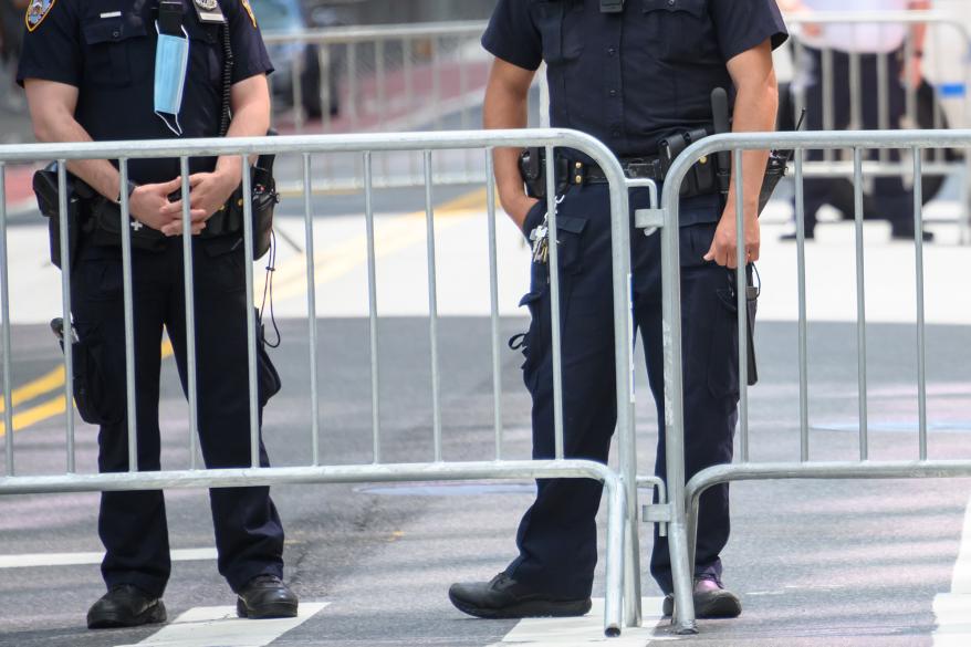 NYPD officers stand outside a Black Lives Matter rally in Times Square