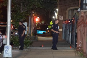 Police are seen on Jennings Ave. near Longfellow Ave. in The Bronx where an off-duty officer was shot at.