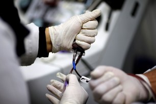 A man who has recovered from the coronavirus disease. donates his plasma