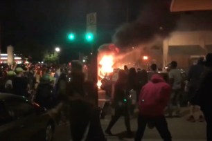 Protesters who barricaded Portland Police Bureau's North Precinct ended up setting a dumpster and debris on fire.