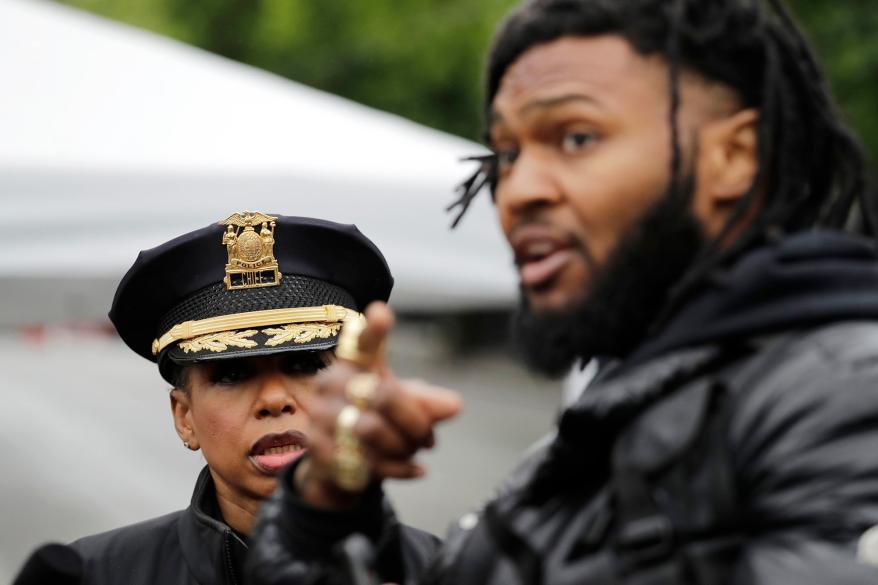 Rapper and activist Raz Simone, right, talks with Seattle Police Chief Carmen Best.