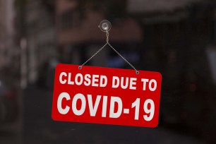 Business with sign saying Closed due to COVID-19