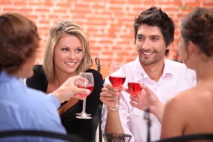 Group of people enjoying glasses of wine at a restaurant