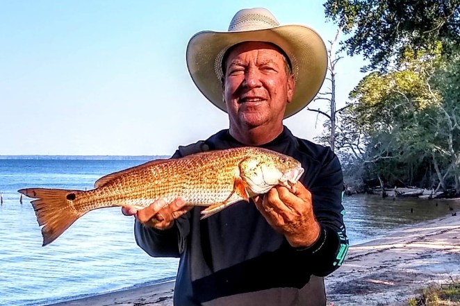 Jeffery Granger holding a river fish