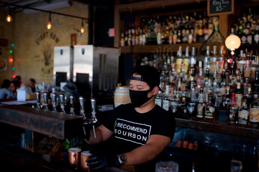 A bartender makes drinks at Eight Row Flint in Houston, Texas.