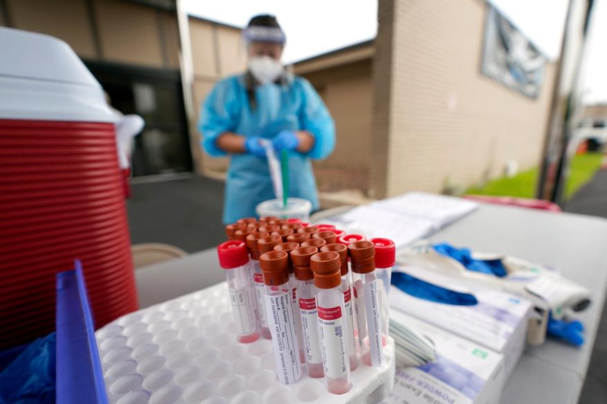 Test kits sit on a table at a United Memorial Medical Center COVID-19 testing site in Houston, Texas.