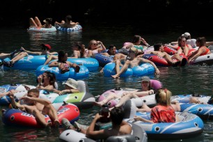 Tubers float the Comal River in New Braunfels, Texas, Wednesday, May 20, 2020.