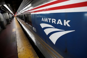 An Amtrak passenger train sits in Pennsylvania Station.