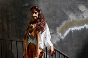 A model poses as she wears a "scarfmask" by The Wolf Belgium and created by Belgian stylist Aude De Wolf in Brussels, Belgium.