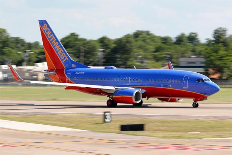 A Southwest Airlines jet takes off from Love Field in Dallas