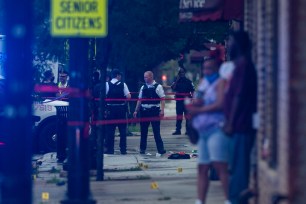 Chicago police investigating the scene of the mass shooting.