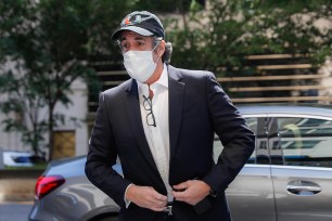 Michael Cohen arrives at his Manhattan apartment in New York after being furloughed from prison in May