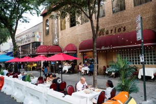 Customers dining outdoors at Mario's Restaurant on Arthur Ave. in the Bronx.