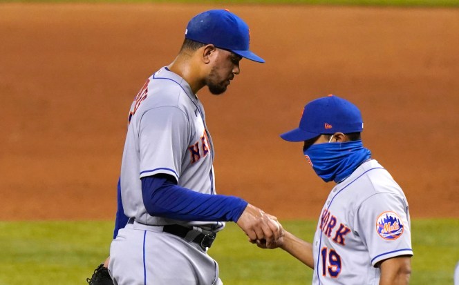 Dellin Betances hands the ball to Luis Rojas after he gets pulled in the eighth inning of the Mets' 5-3 win over the Marlins on Wednesday.