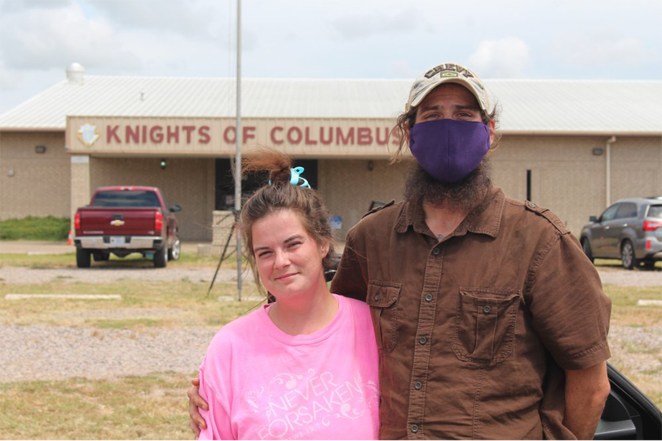 James and Samantha Bisonby their car outside the Knights of Columbus hall where they've been evacuated to as Hurricane Laura approaches