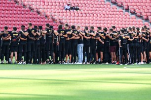 Real Salt Lake and Los Angeles FC players gather for a group photo. Five MLS games were postponed in a collective statement against racial injustice.