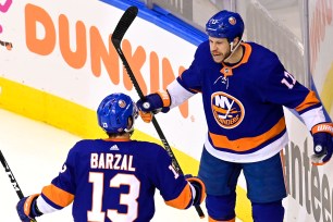 Matt Martin (right) celebrates with Mathew Barzal after scoring a goal in the Islanders' 3-1 Game 3 win over the Flyers.