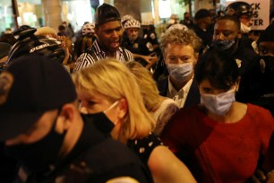 Kentucky Sen. Rand Paul is confronted with protesters in Washington, DC.