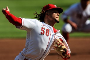Cincinnati Reds' Luis Castillo (58) throws in the first inning during a baseball game against the Detroit Tigers at Great American Ballpark in Cincinnati, Saturday, July 25, 2020.