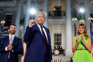 President Trump, first lady Melania Trump (right) and Donald Trump Jr. (left)