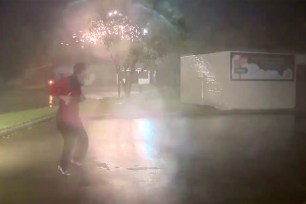 Justin Horne is seen in front of lightning during Hurricane Laura.