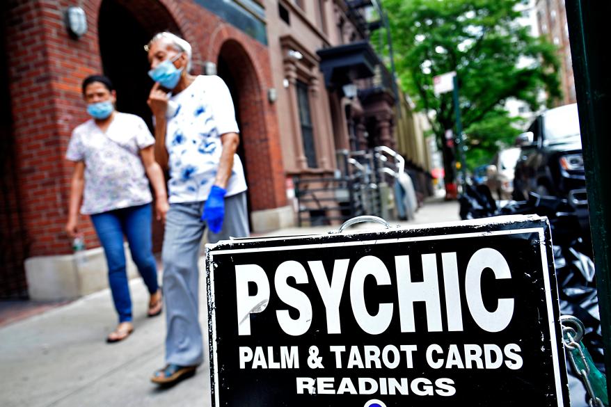 A sign advertising psychic services.