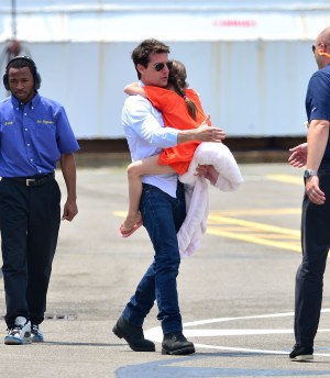Tom Cruise and Suri Cruise leave Manhattan by helicopter at the West Side Heliport on July 18, 2012 in New York City. 