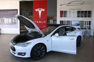 Tesla shares hit record high
