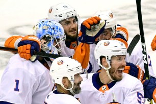 A joyous Islanders team celebrates after their Game 7 win over the Flyers.