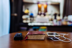 A Bible and smartphones