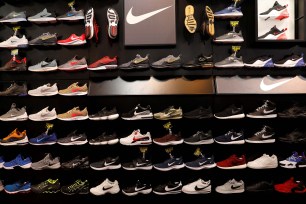 Nike shoes are seen displayed at a sporting goods store.