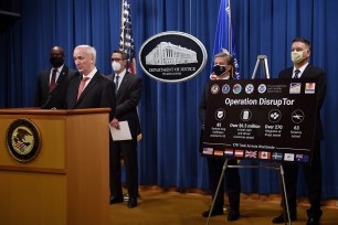 U.S. Deputy Attorney General Jeffrey A. Rosen speaks as (left-to-right) Chief Postal Inspector Gary Barksdale, Immigration and Customs Enforcement acting Deputy Director Derek Benner, FBI Director Christopher Wray and Drug Enforcement Agency acting Administrator Timothy Shea look on