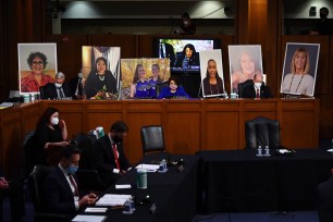 Amy Coney Barrett arrives for a confirmation hearing before the Senate Judiciary Committee