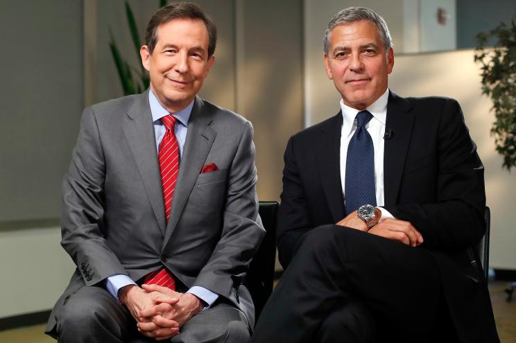 Actor George Clooney, right, following an interview with FOX News Sunday's Chris Wallace, in Washington, Monday, Sept. 12, 2016.