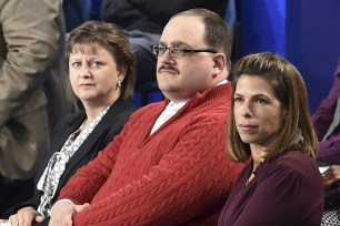 Ken Bone (center) listens to US Democratic nominee Hillary Clinton and Republican nominee Donald Trump during the second presidential debate at Washington University in St. Louis, Missouri.