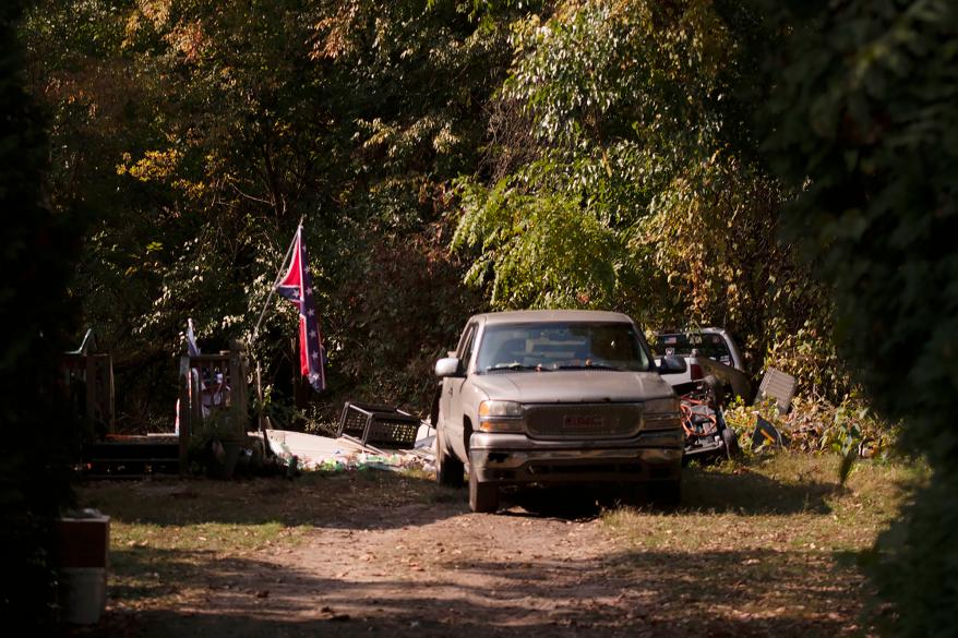 A confederate flag hangs from a porch on a property in Munith, Michigan, where law enforcement officials said suspects accused in a plot to kidnap Michigan Democratic Gov. Gretchen Whitmer met.