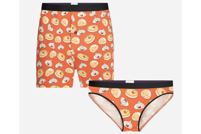 A matching pair of men's boxer shorts and women's underwear with a dumpling pattern