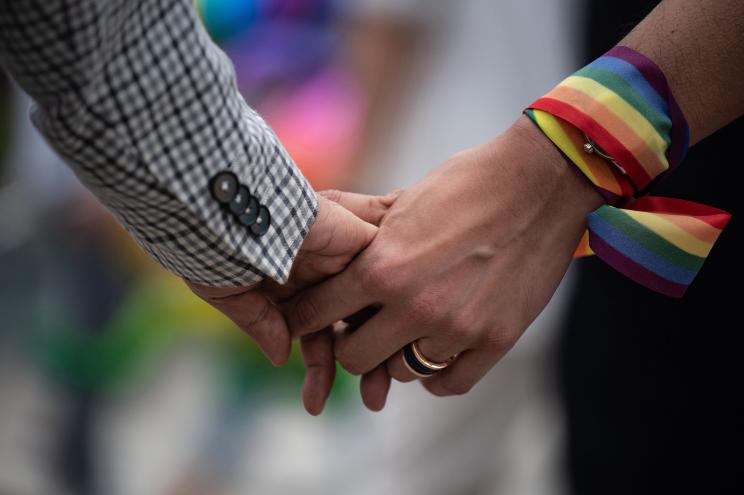 A same-sex couple hold hands during an event to raise awareness of gay rights in Hong Kong.